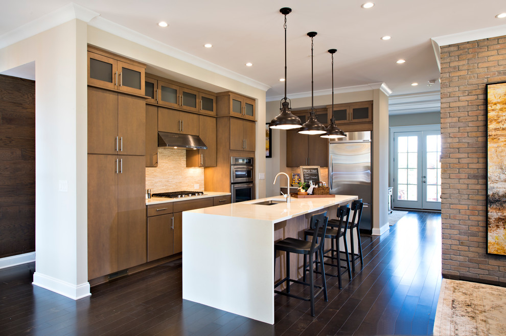 Inspiration for a medium sized contemporary l-shaped kitchen in Charleston with a single-bowl sink, flat-panel cabinets, medium wood cabinets, composite countertops, beige splashback, stainless steel appliances, dark hardwood flooring and an island.