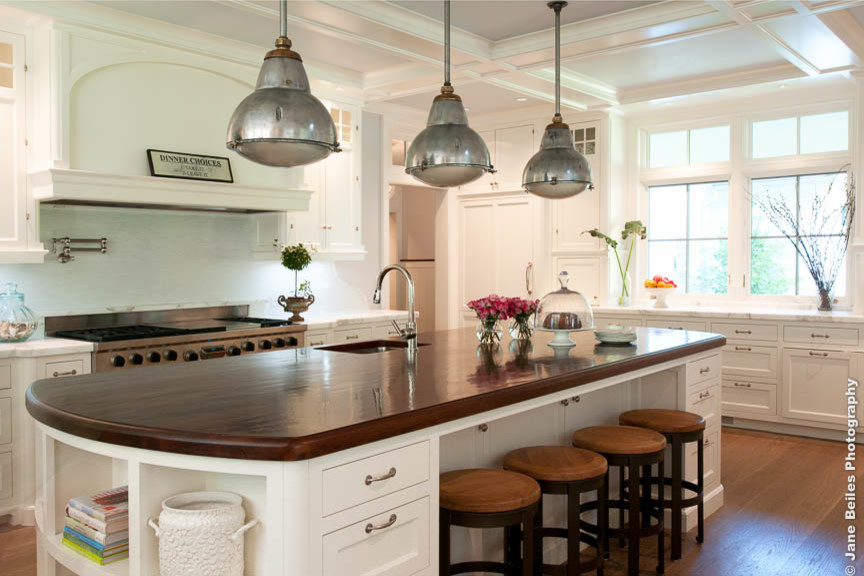 Kitchen - traditional u-shaped kitchen idea in New York with recessed-panel cabinets and an island