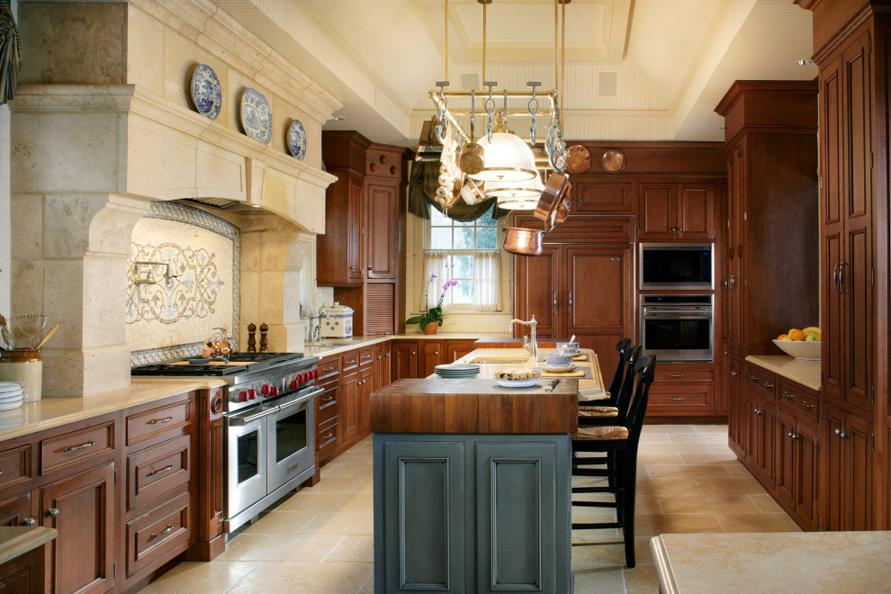 Inspiration for a large timeless u-shaped beige floor and coffered ceiling enclosed kitchen remodel in New York with an undermount sink, beaded inset cabinets, medium tone wood cabinets, beige backsplash, stainless steel appliances, an island and beige countertops