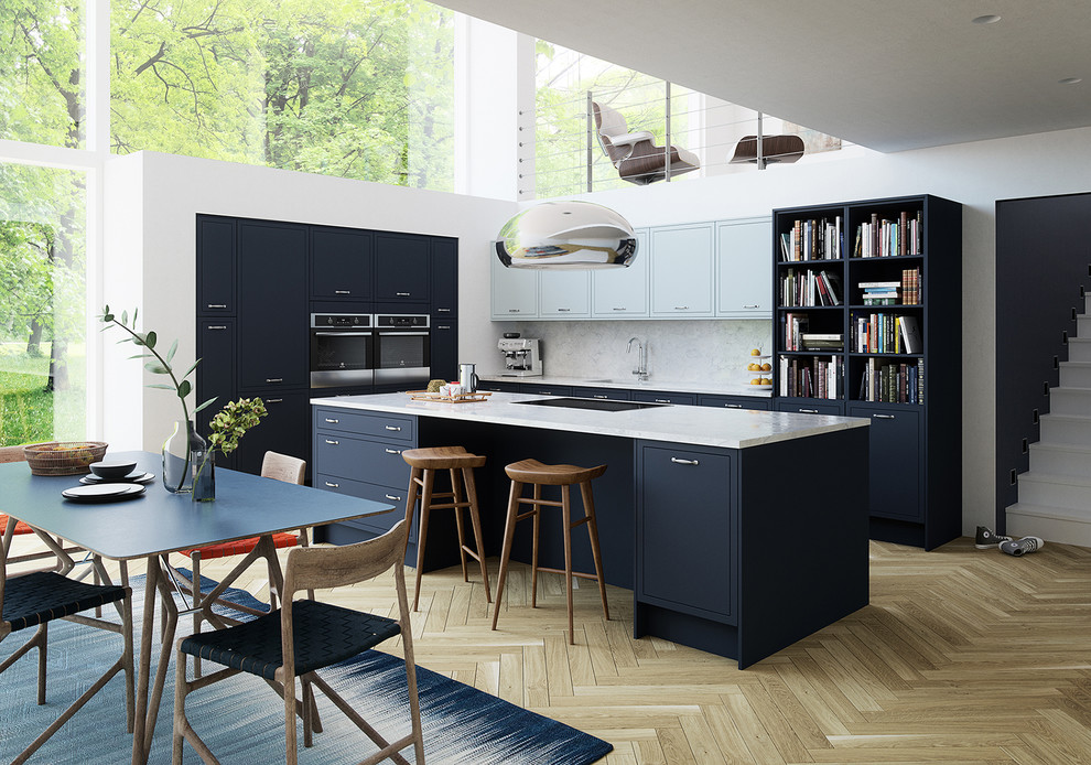 This is an example of a contemporary l-shaped kitchen/diner in Other with a submerged sink, flat-panel cabinets, marble worktops, white splashback, marble splashback, stainless steel appliances, light hardwood flooring, a breakfast bar and beige floors.