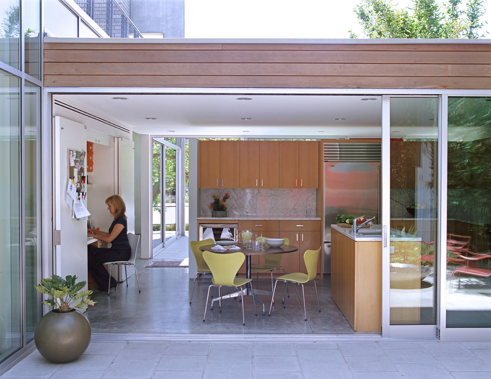 Minimalist kitchen photo in Los Angeles with stainless steel appliances