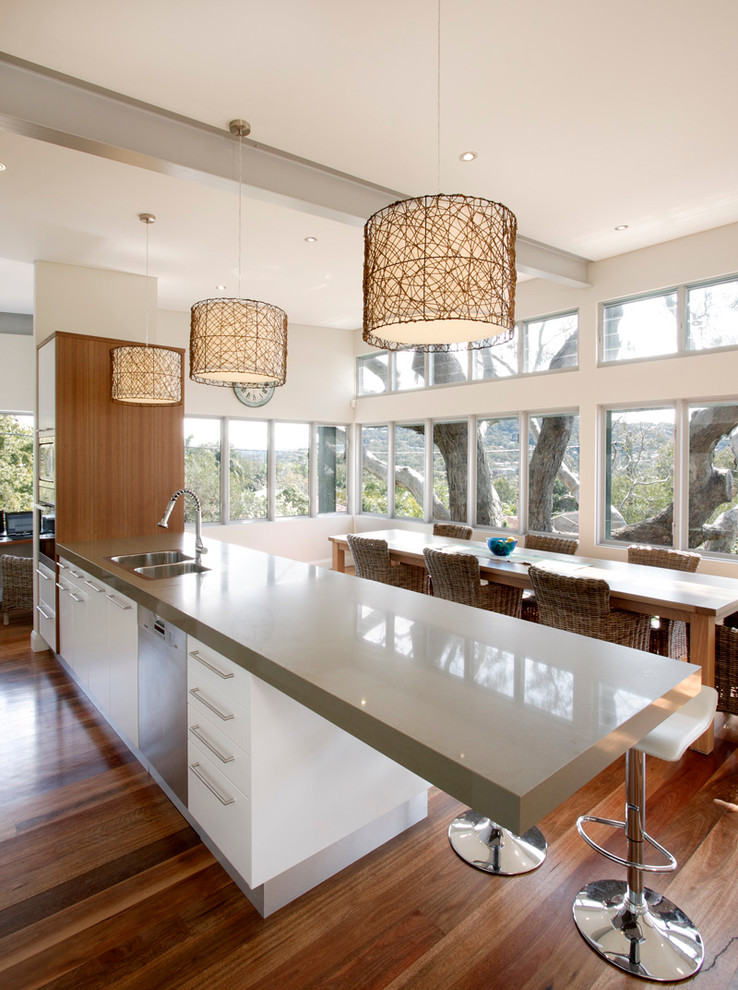 Contemporary galley kitchen/diner in Sydney with an island.