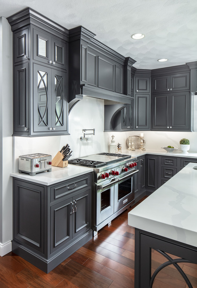 Eat-in kitchen - large traditional l-shaped dark wood floor eat-in kitchen idea in Boston with an undermount sink, beaded inset cabinets, gray cabinets, quartz countertops, stainless steel appliances, an island and white countertops