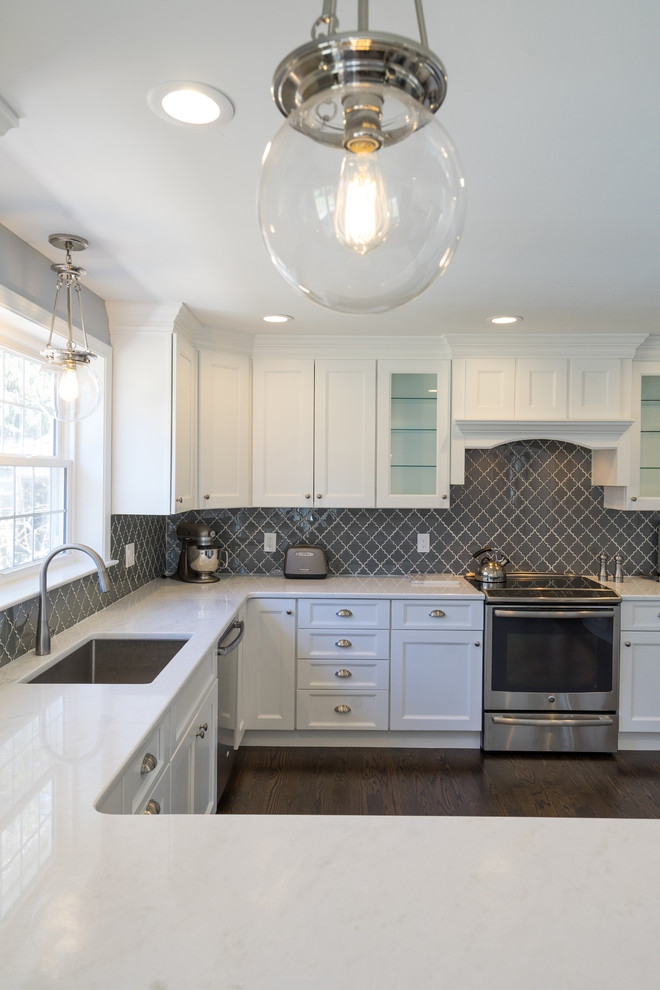 Eat-in kitchen - transitional u-shaped dark wood floor eat-in kitchen idea in Philadelphia with an undermount sink, recessed-panel cabinets, white cabinets, quartzite countertops, gray backsplash, porcelain backsplash, stainless steel appliances and a peninsula