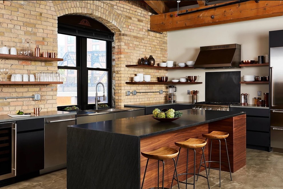 Moderne Küche in L-Form mit flächenbündigen Schrankfronten, schwarzen Schränken, Küchengeräten aus Edelstahl, Kücheninsel und grauem Boden in Washington, D.C.