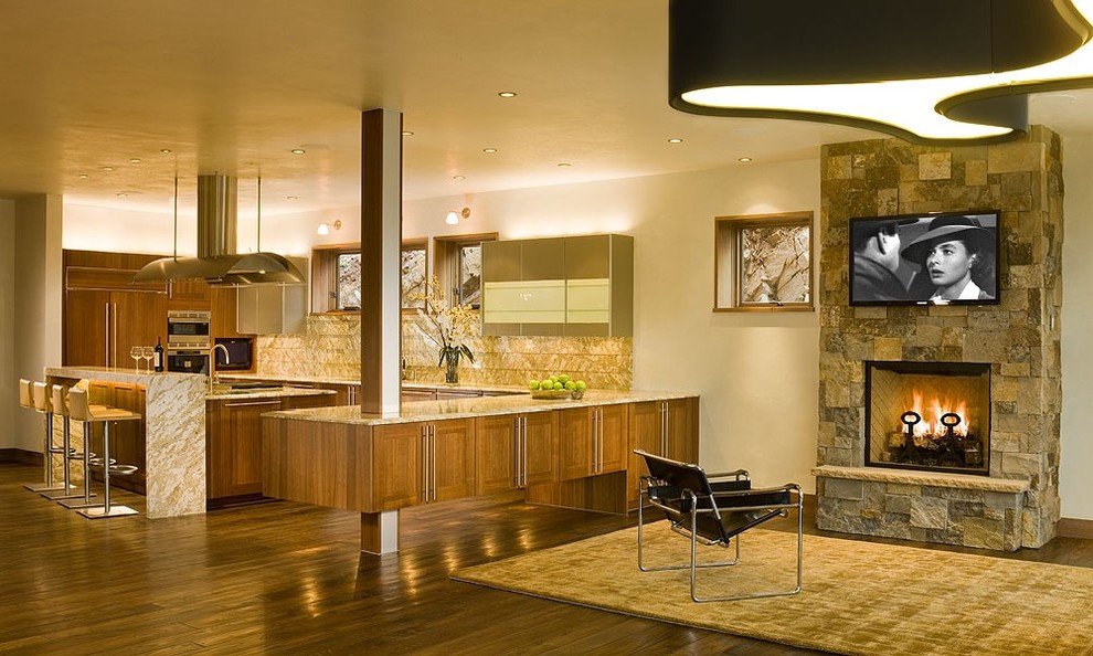 This is an example of a large contemporary u-shaped open plan kitchen in Denver with a submerged sink, flat-panel cabinets, medium wood cabinets, granite worktops, beige splashback, stainless steel appliances, dark hardwood flooring and an island.