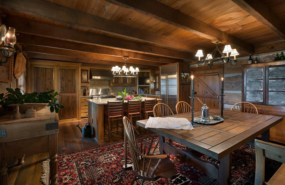 Eat-in kitchen - large rustic l-shaped medium tone wood floor eat-in kitchen idea in Charleston with raised-panel cabinets, medium tone wood cabinets and an island