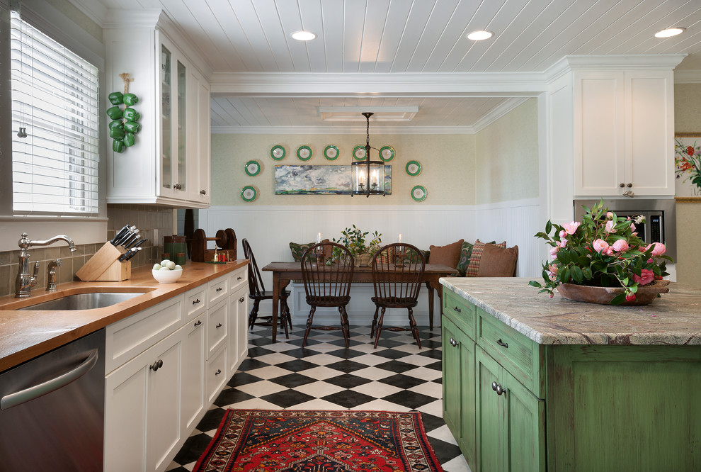 Inspiration for a rustic u-shaped kitchen/diner in Charleston with a submerged sink, shaker cabinets, white cabinets, grey splashback, stainless steel appliances, vinyl flooring and an island.