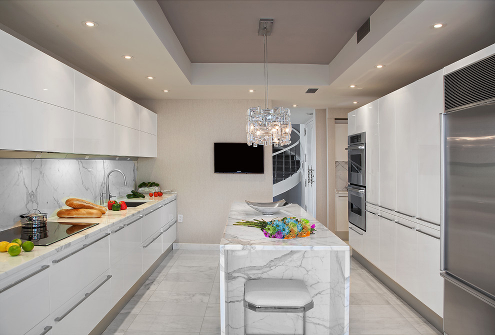 Medium sized contemporary galley kitchen in New York with a submerged sink, flat-panel cabinets, white cabinets, marble worktops, white splashback, stone slab splashback and marble flooring.