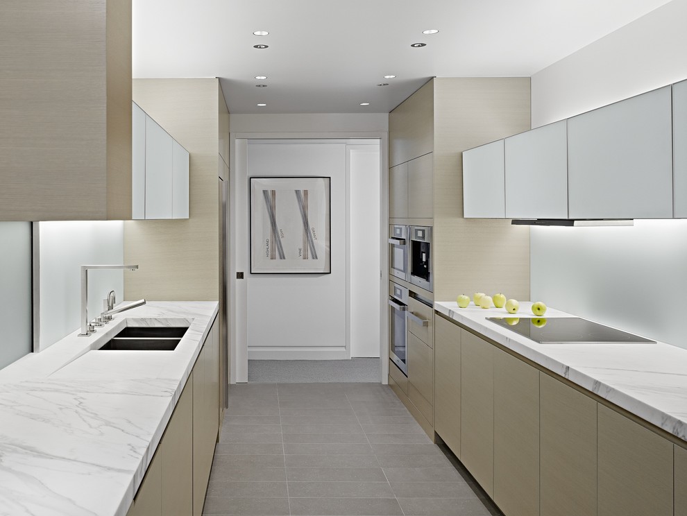 Inspiration for a contemporary galley enclosed kitchen in San Francisco with marble worktops.