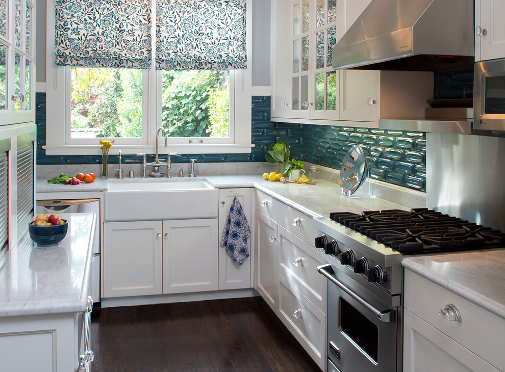 Design ideas for a contemporary l-shaped enclosed kitchen in San Francisco with a belfast sink, recessed-panel cabinets, white cabinets, blue splashback and stainless steel appliances.