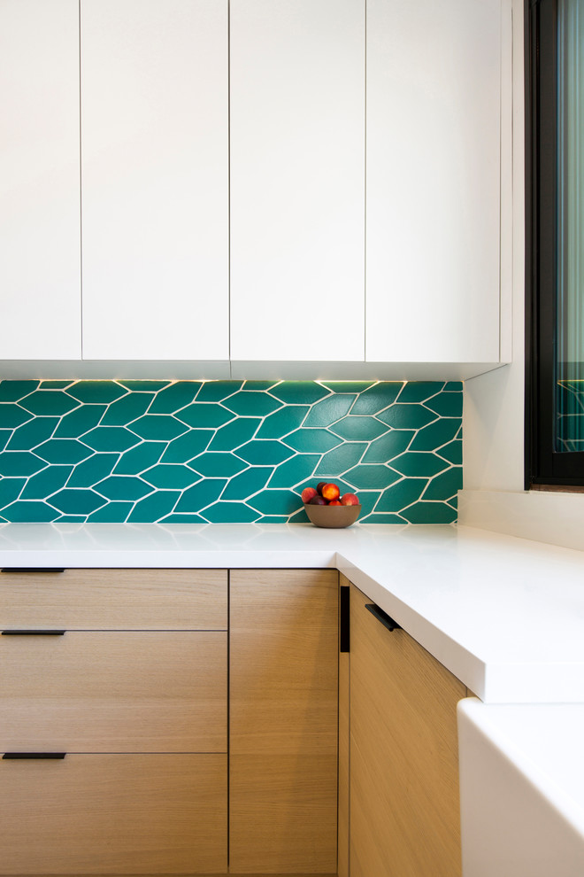 Inspiration for a modern kitchen in San Francisco with a belfast sink, flat-panel cabinets, light wood cabinets and engineered stone countertops.