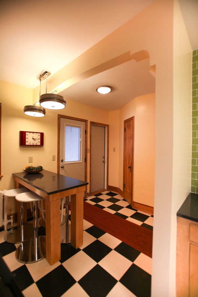 Eclectic kitchen photo in Minneapolis with recycled glass countertops and subway tile backsplash