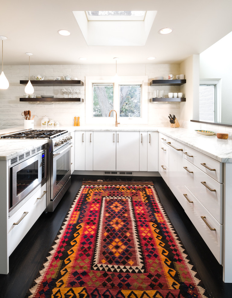 Example of a trendy u-shaped kitchen design in Denver with flat-panel cabinets, white cabinets and white backsplash