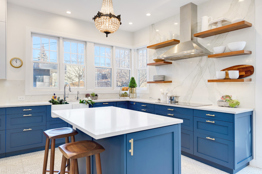 Inspiration for a large transitional l-shaped porcelain tile and white floor enclosed kitchen remodel in Chicago with a farmhouse sink, shaker cabinets, blue cabinets, quartzite countertops, white backsplash, marble backsplash, paneled appliances and an island