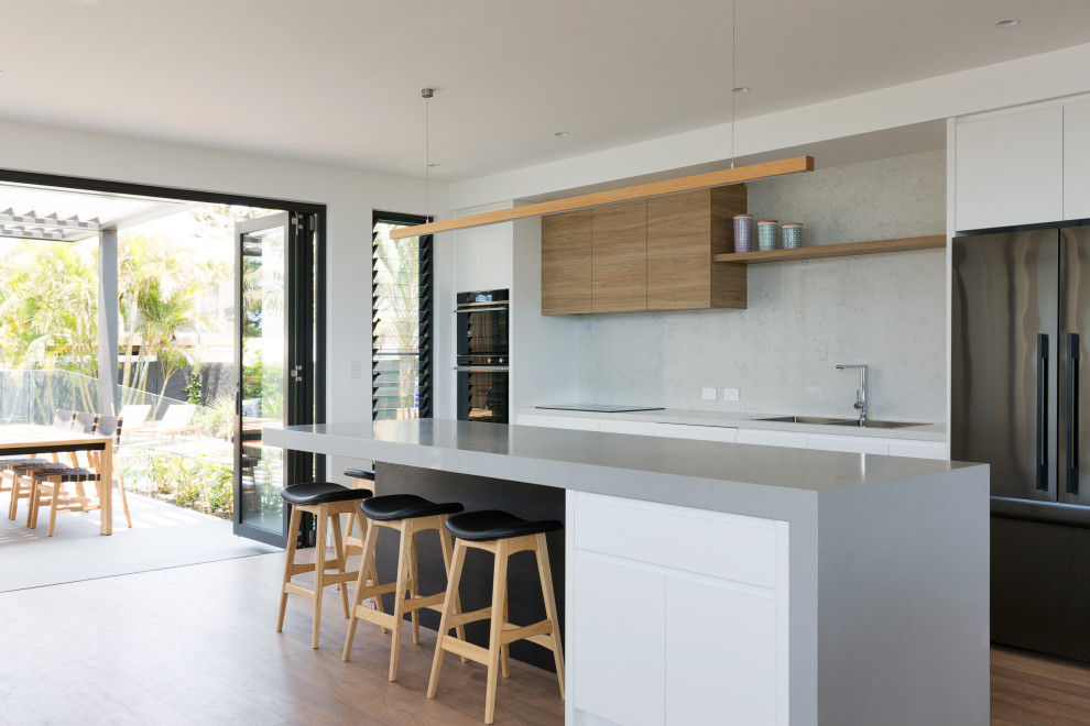 This is an example of a coastal kitchen in Sydney.