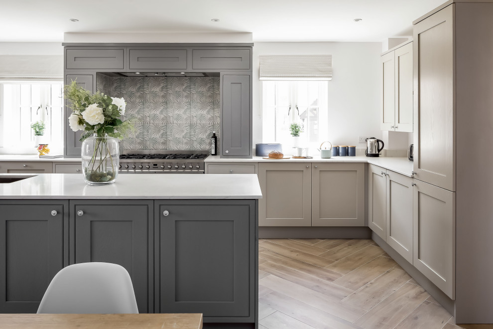 Inspiration for an expansive traditional u-shaped open plan kitchen in Dorset with shaker cabinets, grey cabinets, quartz worktops and an island.