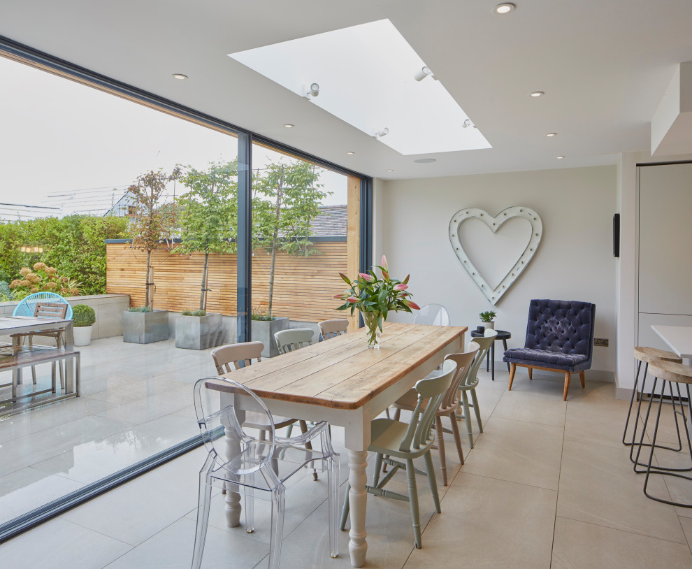 This is an example of a medium sized contemporary kitchen/dining room in Berkshire with porcelain flooring and grey floors.