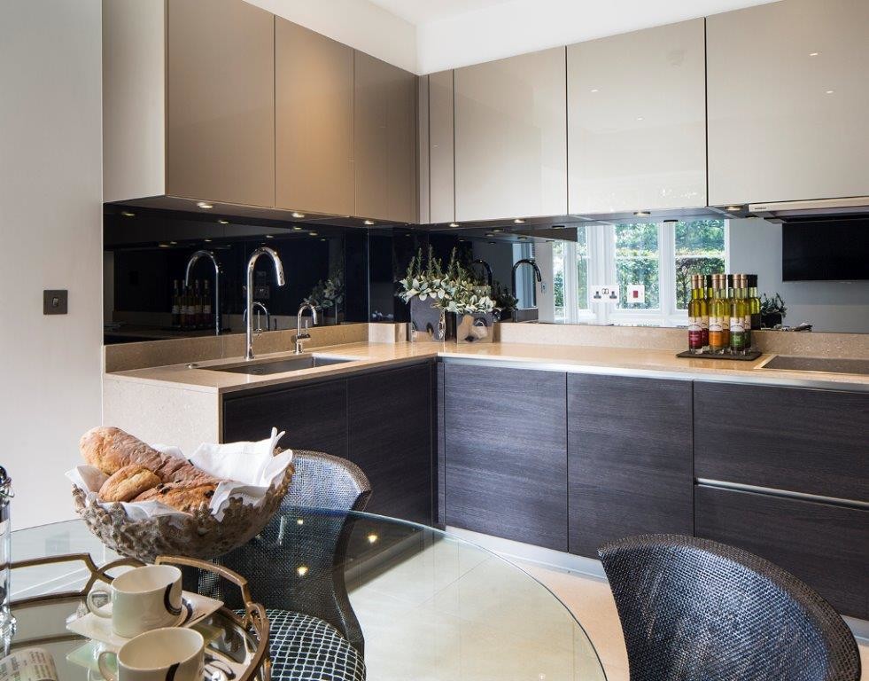 Design ideas for a medium sized modern u-shaped kitchen/diner in London with a built-in sink, flat-panel cabinets, dark wood cabinets, granite worktops, black splashback, glass sheet splashback, porcelain flooring and no island.