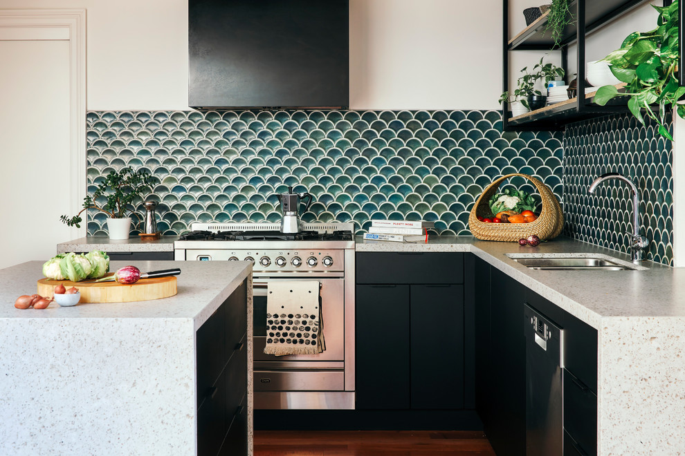 Inspiration for a contemporary kitchen/diner in Melbourne with a submerged sink, black cabinets, engineered stone countertops, blue splashback, mosaic tiled splashback, stainless steel appliances, medium hardwood flooring, an island, brown floors and multicoloured worktops.