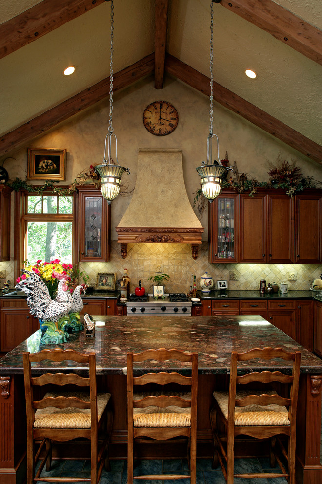 Example of a large classic l-shaped eat-in kitchen design in Minneapolis with raised-panel cabinets, medium tone wood cabinets, beige backsplash, stainless steel appliances, an island, a drop-in sink and granite countertops