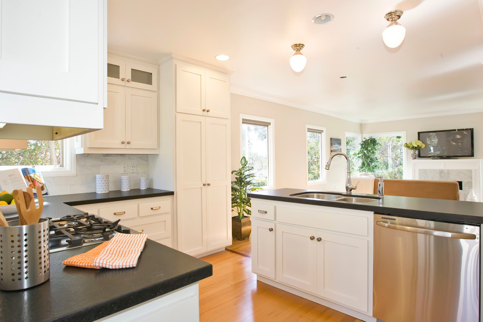 Inspiration for a classic kitchen in San Diego with a double-bowl sink, recessed-panel cabinets and white cabinets.
