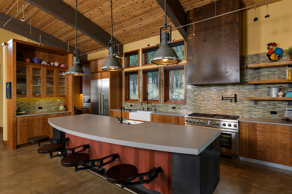 Inspiration for an eclectic l-shaped brown floor open concept kitchen remodel in Other with a farmhouse sink, flat-panel cabinets, medium tone wood cabinets, matchstick tile backsplash, stainless steel appliances and an island
