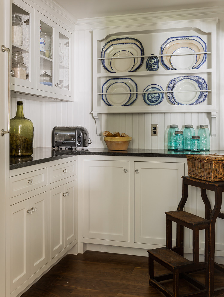 Design ideas for a classic kitchen pantry in Boston with glass-front cabinets, integrated appliances, medium hardwood flooring, white cabinets and granite worktops.