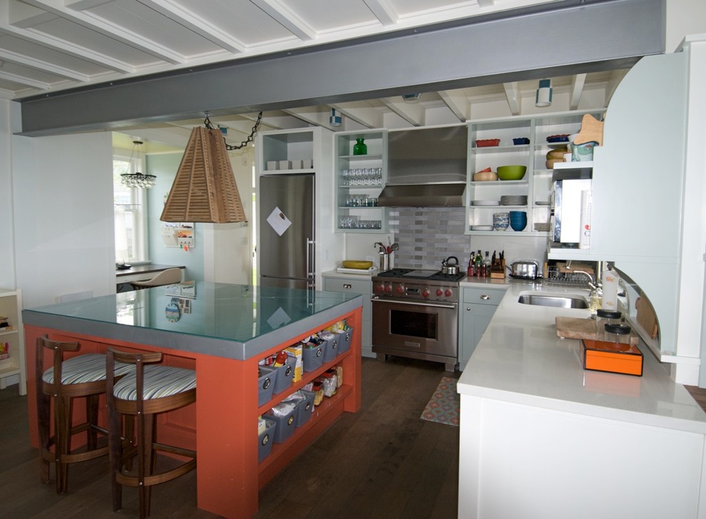 Example of a beach style kitchen design in Boston with open cabinets, glass countertops, metallic backsplash and metal backsplash