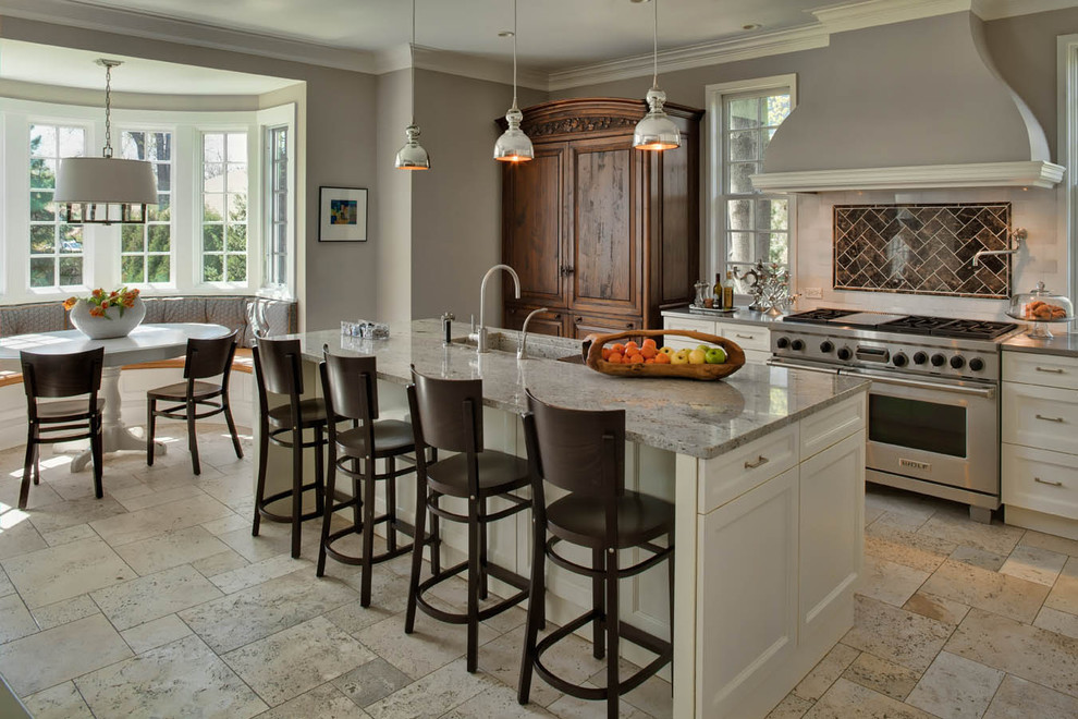 Eat-in kitchen - traditional eat-in kitchen idea in Chicago with shaker cabinets, white cabinets, brown backsplash and stainless steel appliances