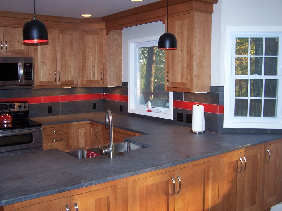 Inspiration for a timeless u-shaped eat-in kitchen remodel in Philadelphia with an undermount sink, shaker cabinets, light wood cabinets, soapstone countertops, gray backsplash, porcelain backsplash and stainless steel appliances