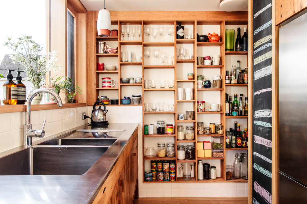 Eat-in kitchen - small eclectic galley light wood floor eat-in kitchen idea in Melbourne with an integrated sink, recessed-panel cabinets, light wood cabinets, marble countertops, blue backsplash, ceramic backsplash, stainless steel appliances and a peninsula