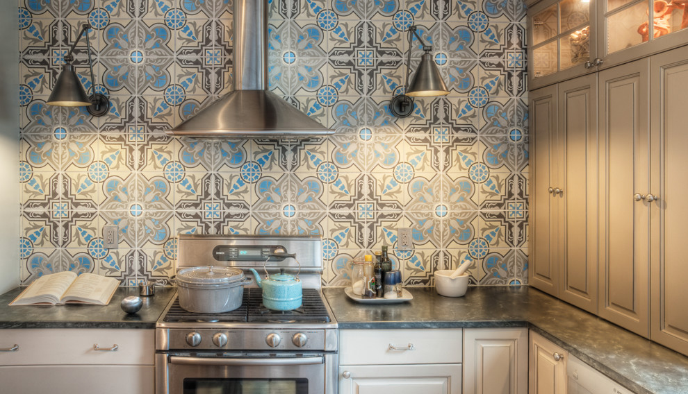 Inspiration for a timeless kitchen remodel in Philadelphia with raised-panel cabinets, stainless steel appliances, soapstone countertops and blue backsplash