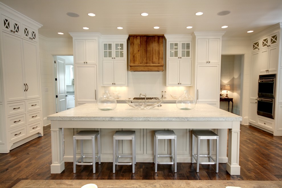Example of a classic kitchen design in Atlanta with granite countertops and white cabinets