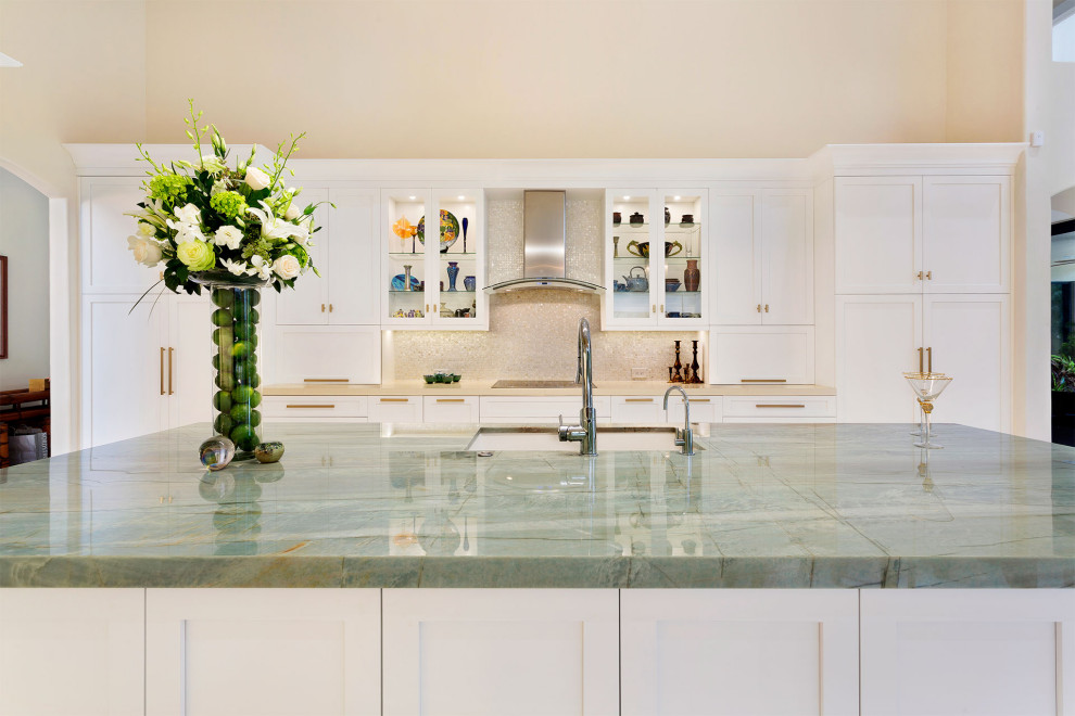 Photo of a medium sized classic u-shaped kitchen/diner in Miami with a submerged sink, shaker cabinets, white cabinets, marble worktops, beige splashback, mosaic tiled splashback, stainless steel appliances, light hardwood flooring, an island, beige floors and green worktops.