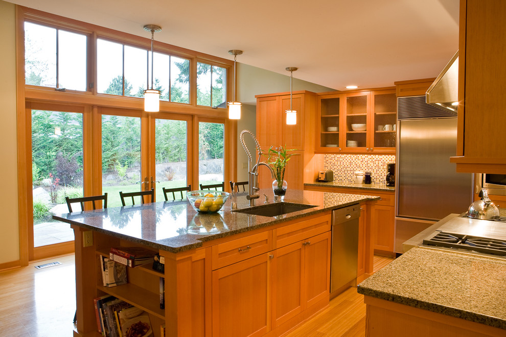 Esempio di una cucina minimal con elettrodomestici in acciaio inossidabile, ante di vetro, ante in legno scuro, paraspruzzi multicolore e paraspruzzi con piastrelle a mosaico