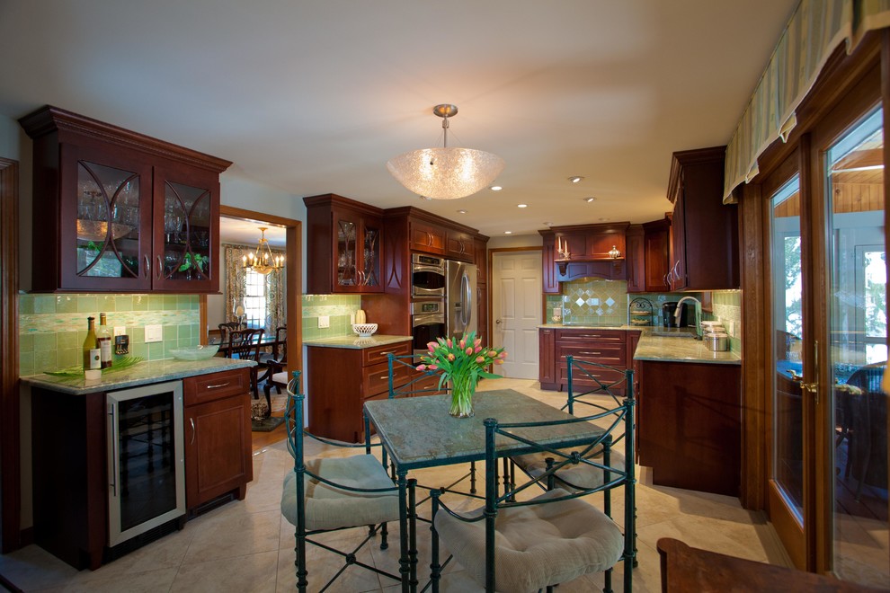 Photo of a large traditional u-shaped kitchen in Boston with a submerged sink, beaded cabinets, dark wood cabinets, marble worktops, green splashback, ceramic splashback, stainless steel appliances and limestone flooring.