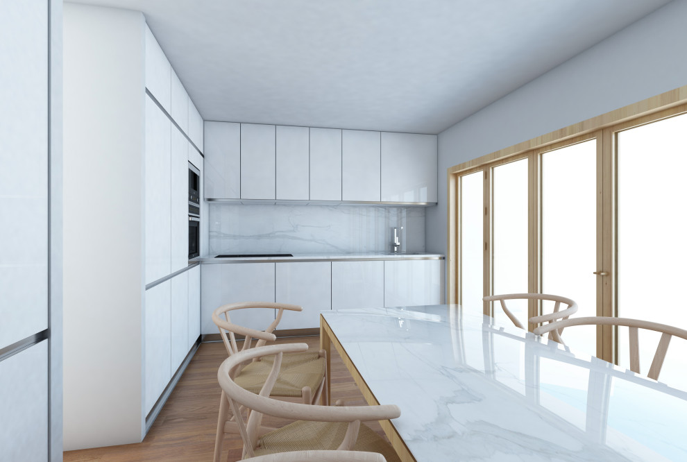 Diseño de cocina minimalista con armarios con paneles lisos, puertas de armario blancas, suelo de madera en tonos medios, suelo marrón y encimeras blancas