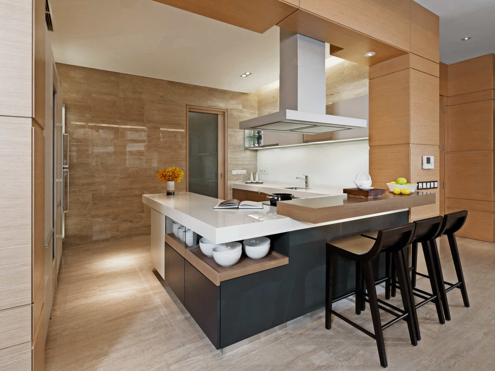 Contemporary kitchen in Singapore with a submerged sink, a breakfast bar and beige floors.
