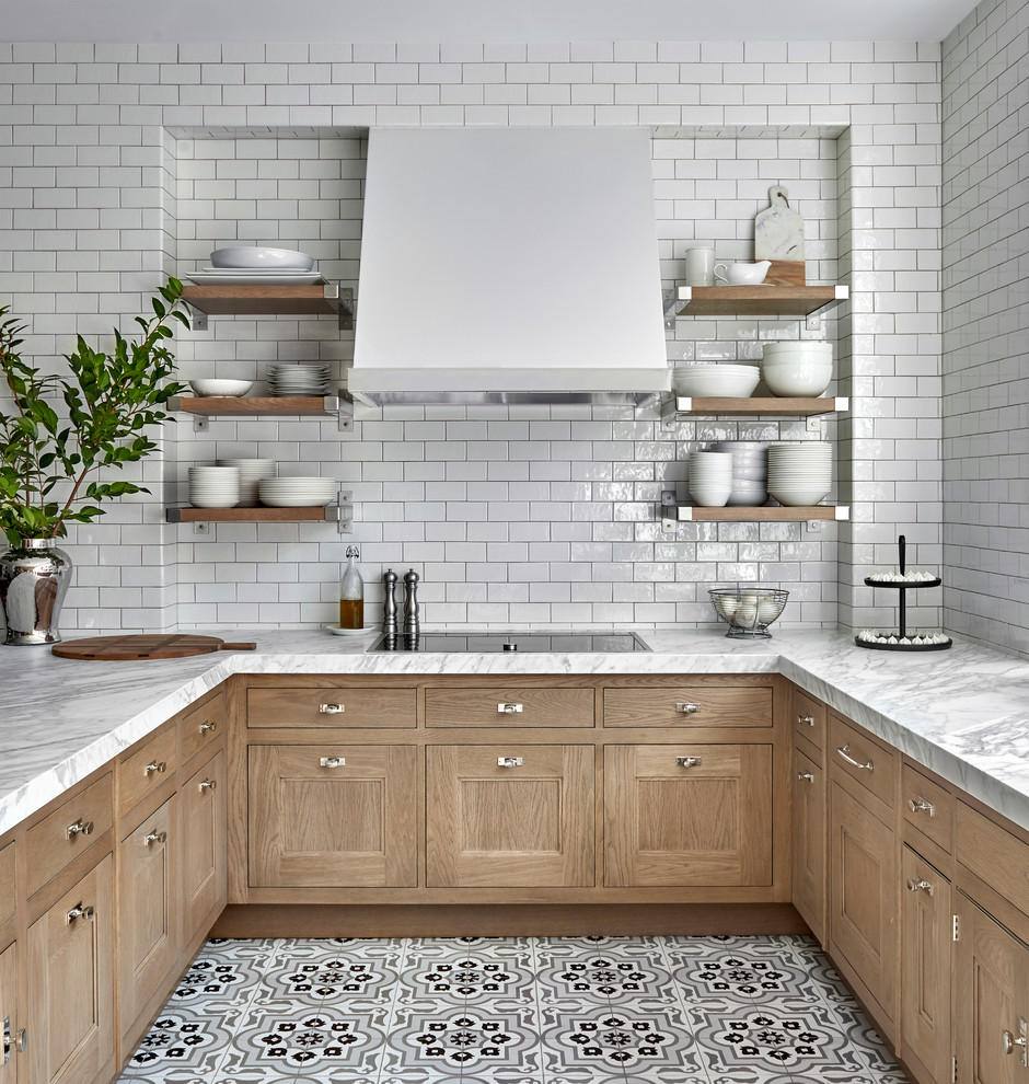Inspiration for a traditional kitchen/diner in Chicago with a submerged sink, recessed-panel cabinets, light wood cabinets, quartz worktops, white splashback, ceramic splashback, porcelain flooring, a breakfast bar, multi-coloured floors and white worktops.