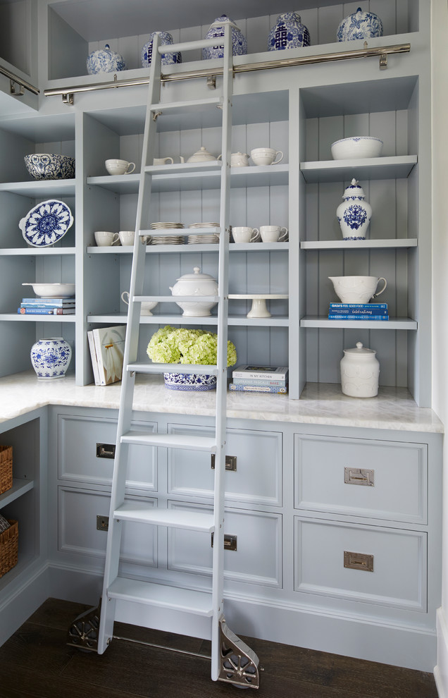 Inspiration for a timeless l-shaped dark wood floor and brown floor kitchen pantry remodel in Chicago with recessed-panel cabinets, quartzite countertops, blue backsplash, wood backsplash, white countertops and gray cabinets