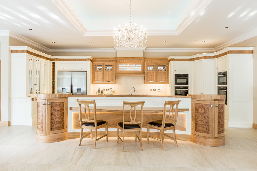 Design ideas for a large traditional u-shaped open plan kitchen in Other with an integrated sink, beaded cabinets, medium wood cabinets, quartz worktops, porcelain flooring and an island.