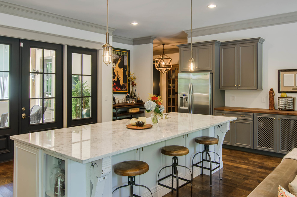 Inspiration for a transitional kitchen remodel in Nashville with recessed-panel cabinets, gray cabinets, wood countertops and stainless steel appliances
