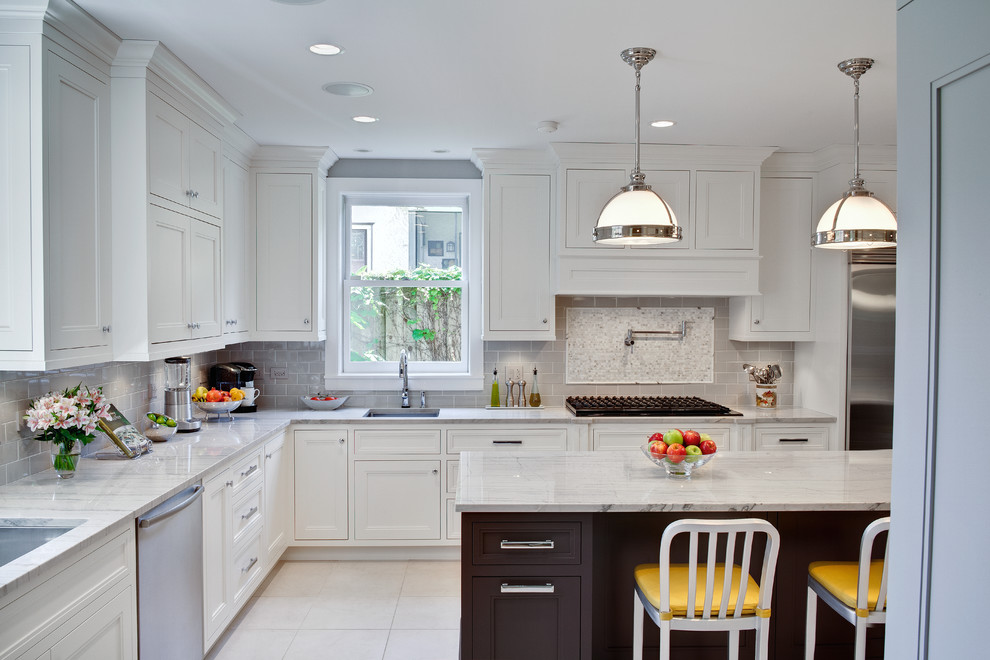 Inspiration for a timeless kitchen remodel in Chicago with ceramic backsplash, quartzite countertops, gray backsplash, an undermount sink, white cabinets and recessed-panel cabinets