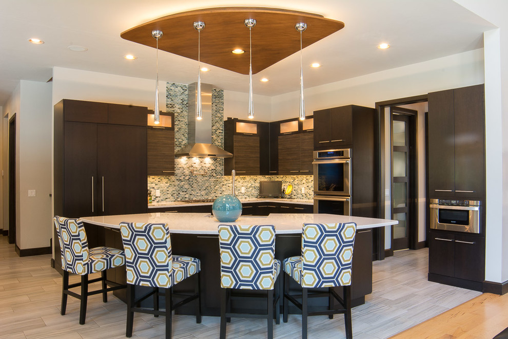 Large arts and crafts l-shaped vinyl floor and gray floor open concept kitchen photo in Oklahoma City with a farmhouse sink, flat-panel cabinets, dark wood cabinets, quartz countertops, blue backsplash, mosaic tile backsplash, stainless steel appliances and an island