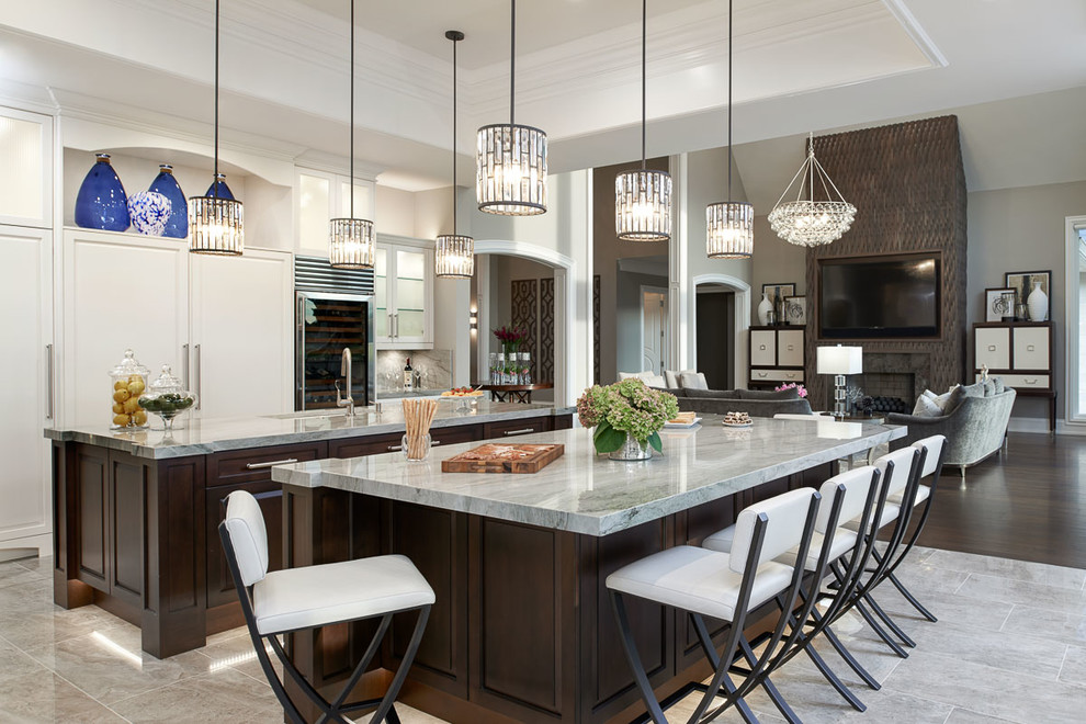 Huge trendy galley porcelain tile eat-in kitchen photo in Detroit with an undermount sink, beaded inset cabinets, white cabinets, granite countertops, gray backsplash, stone slab backsplash, stainless steel appliances and two islands