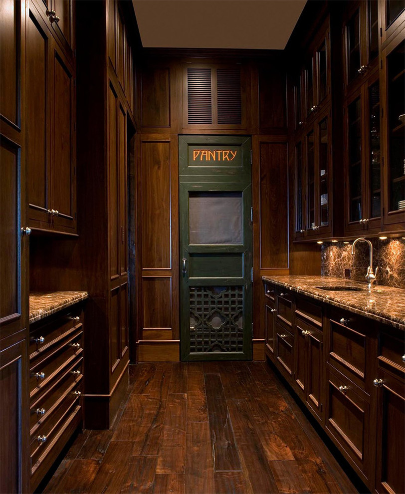Photo of a small traditional galley kitchen pantry in Charleston with a submerged sink, recessed-panel cabinets, medium wood cabinets, brown splashback, medium hardwood flooring and no island.