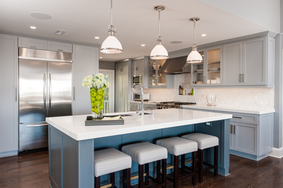 Inspiration for a classic kitchen in Wilmington with a double-bowl sink, shaker cabinets, grey cabinets, engineered stone countertops, stone tiled splashback, stainless steel appliances, dark hardwood flooring and an island.