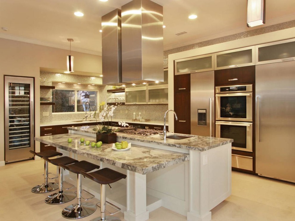 Example of a large trendy l-shaped ceramic tile and beige floor enclosed kitchen design in Los Angeles with an undermount sink, stainless steel appliances, flat-panel cabinets, dark wood cabinets, quartzite countertops, beige backsplash, mosaic tile backsplash and an island