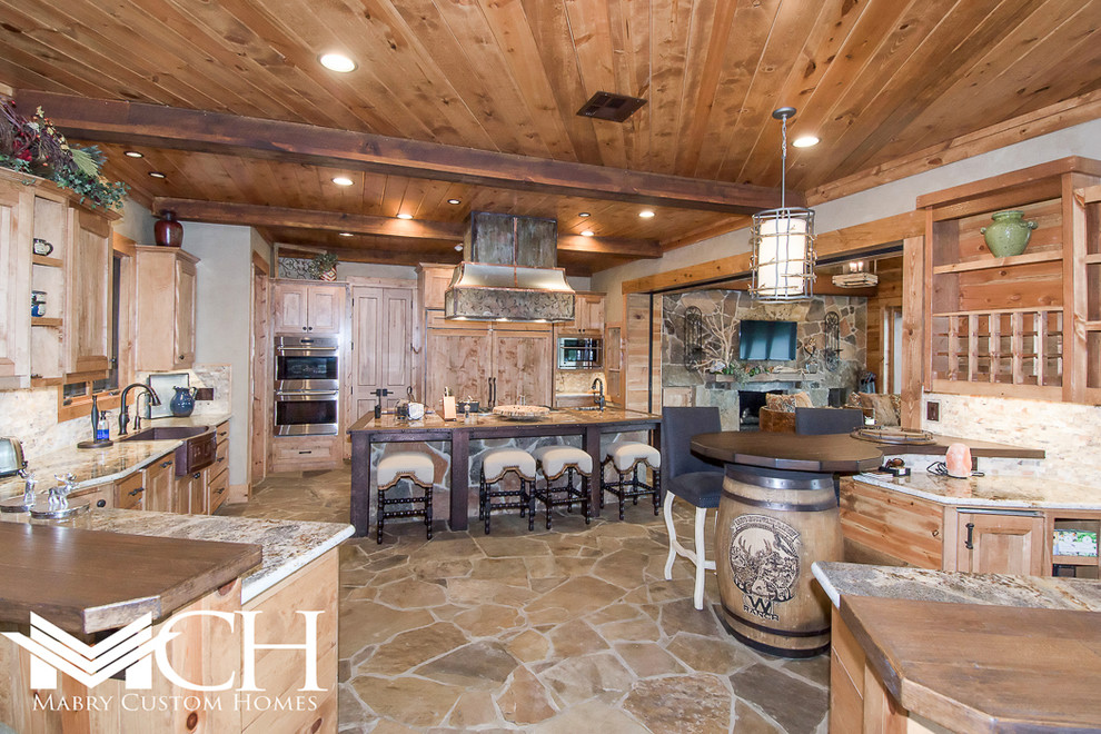 Inspiration for a huge rustic kitchen remodel in Dallas with an island